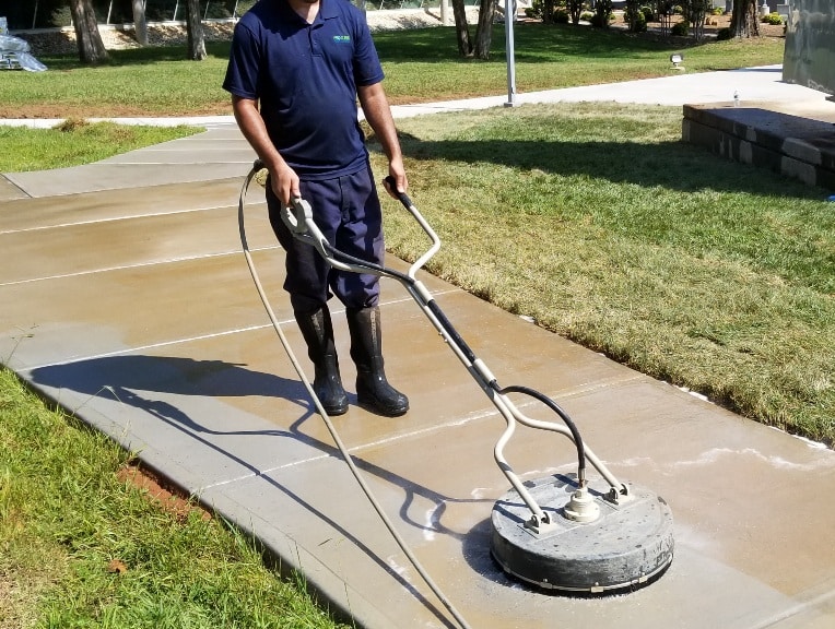 Surface cleaning red clay from concrete